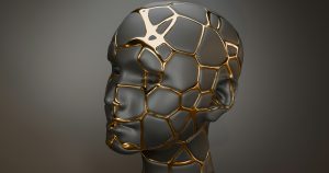 A dark porcelain head and face with seams of gold running through the cracks, symbolising healing and strength after trauma through EMDR
